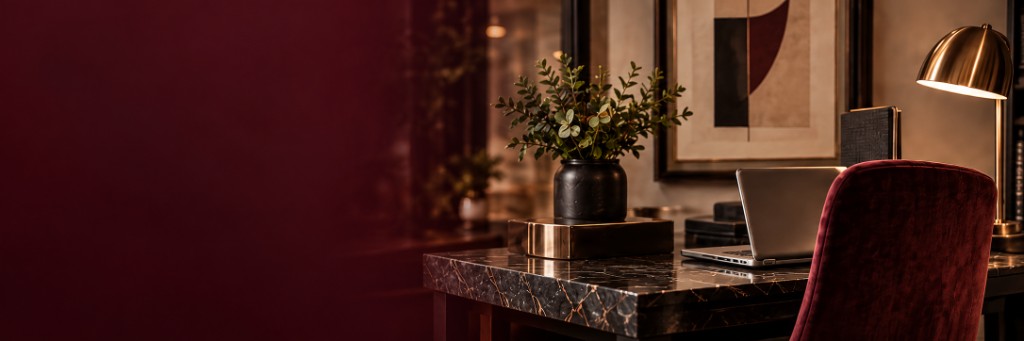 A considered NGT Designs interior with a marble desk and velvet chair